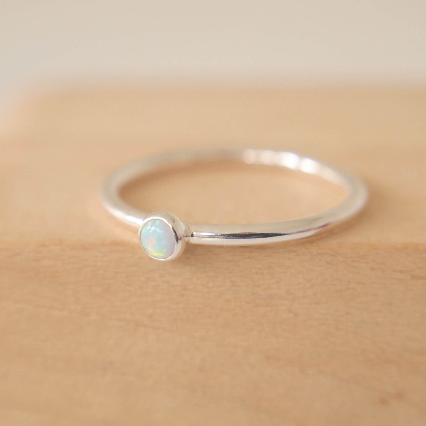 Lab Opal birthstone stacking ring with small gemstone. Hand made in Scotland by maram jewellery