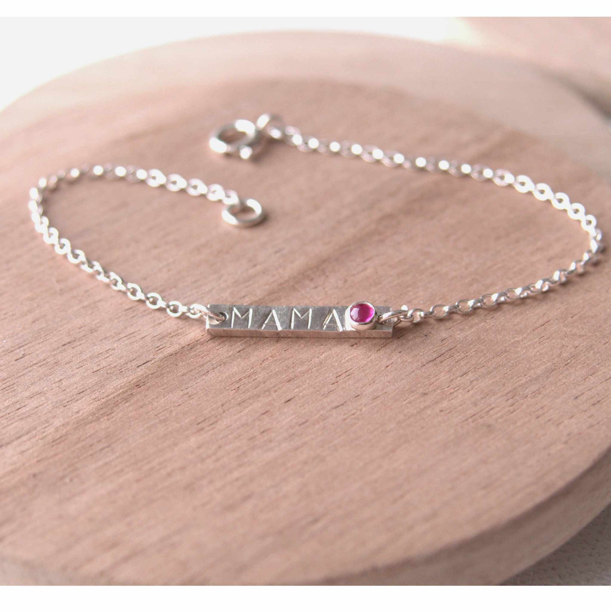 Silver Bar bracelet with hand stamped MAMA with a baby birthstone in July Lab Ruby. Handmade by maram jewellery in Scotland UK