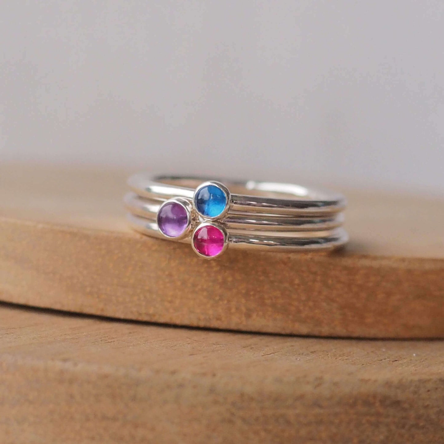 Lab Sapphire, Lab Ruby and Amethyst three gemstone ring set. Handmade in Scotland by maram jewellery