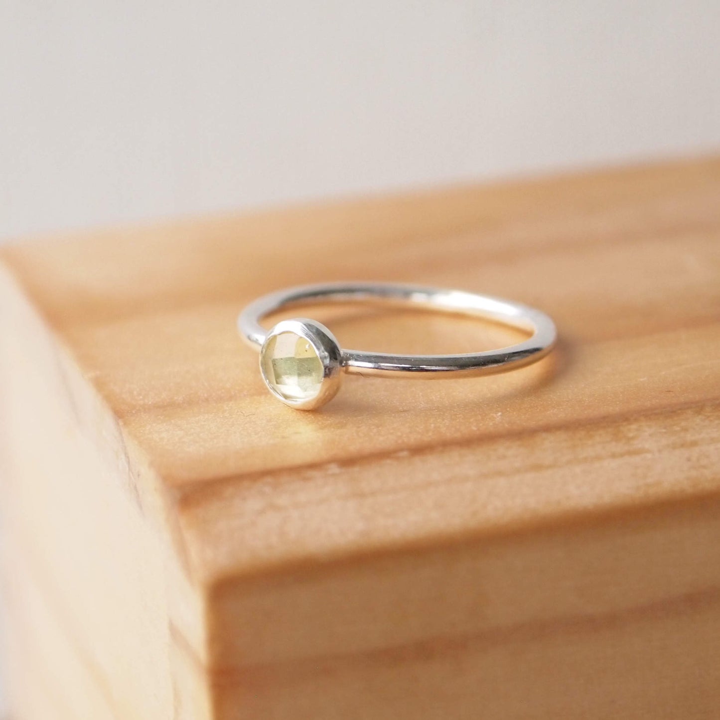 Yellow Quartz Sterling Silver Gemstone ring with a round 5mm facet cut pale lemon yellow cabochon. Handmade in Scotland by maram jewellery