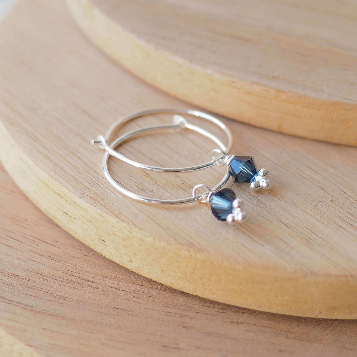 Teal Crystal simple wire hoop earrings with a crystal dropper in a petrol blue. Handmade in Scotland UK by maram jewellery
