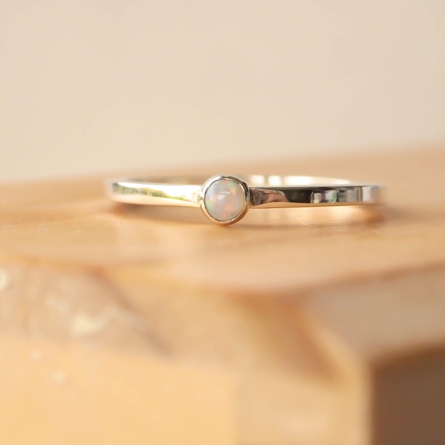 Sterling Silver and genuine Opal Silver ring on a square profile band. Handmade in Scotland by maram jewellery