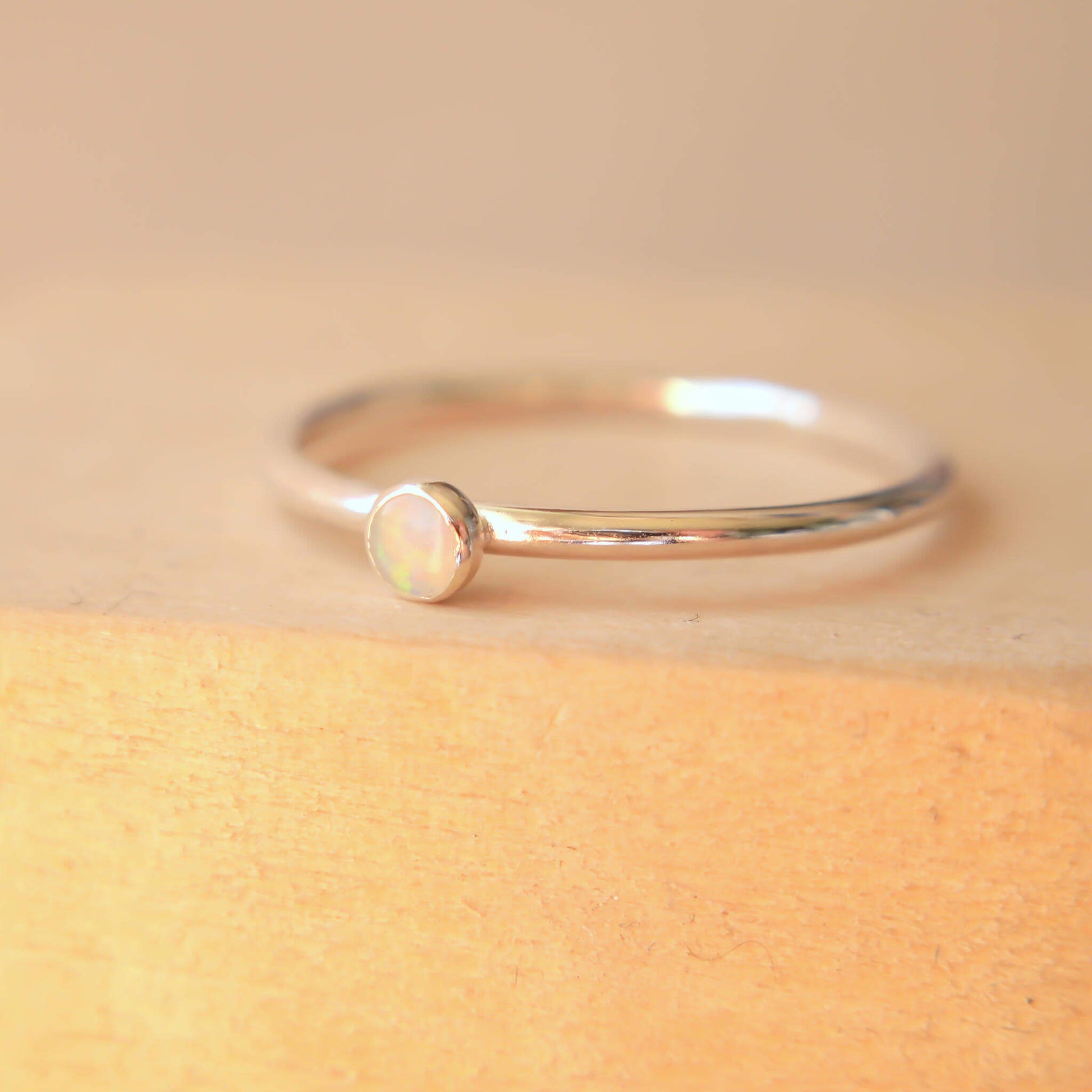 Sterling Silver and genuine Opal Silver ring on a fully round band. Handmade in Scotland by maram jewellery