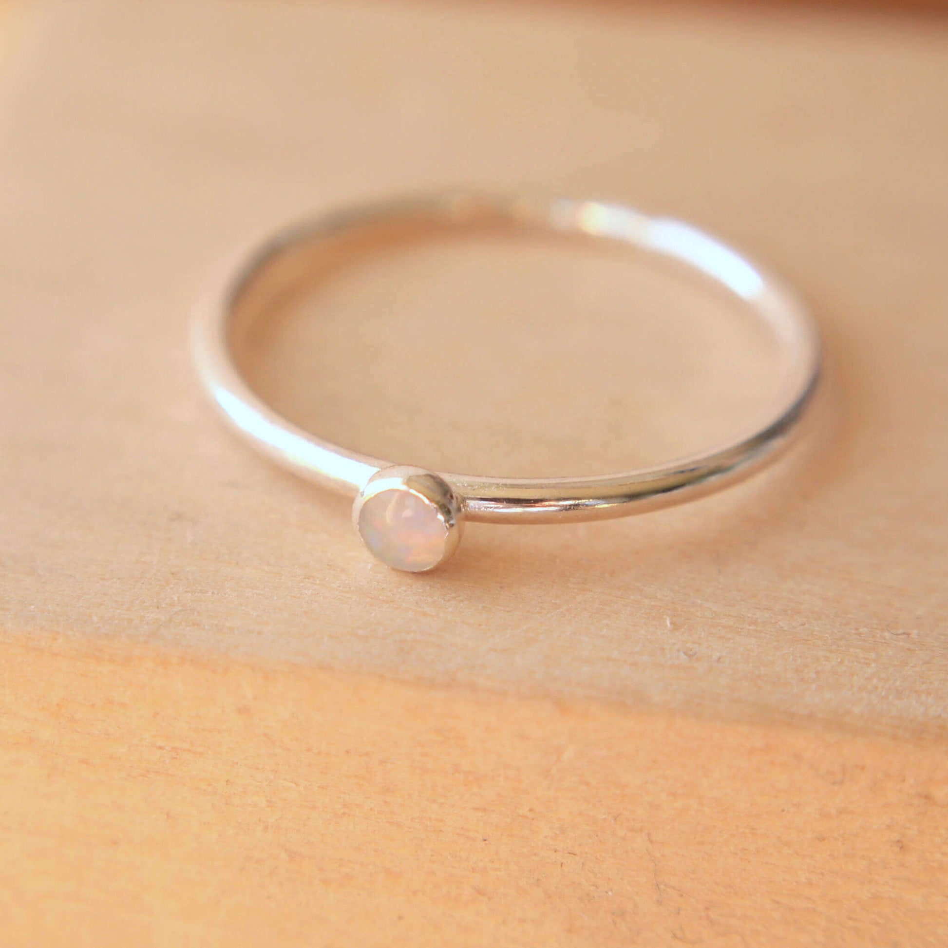 Sterling Silver and genuine Opal Silver ring on a fully round band. Handmade in Scotland by maram jewellery