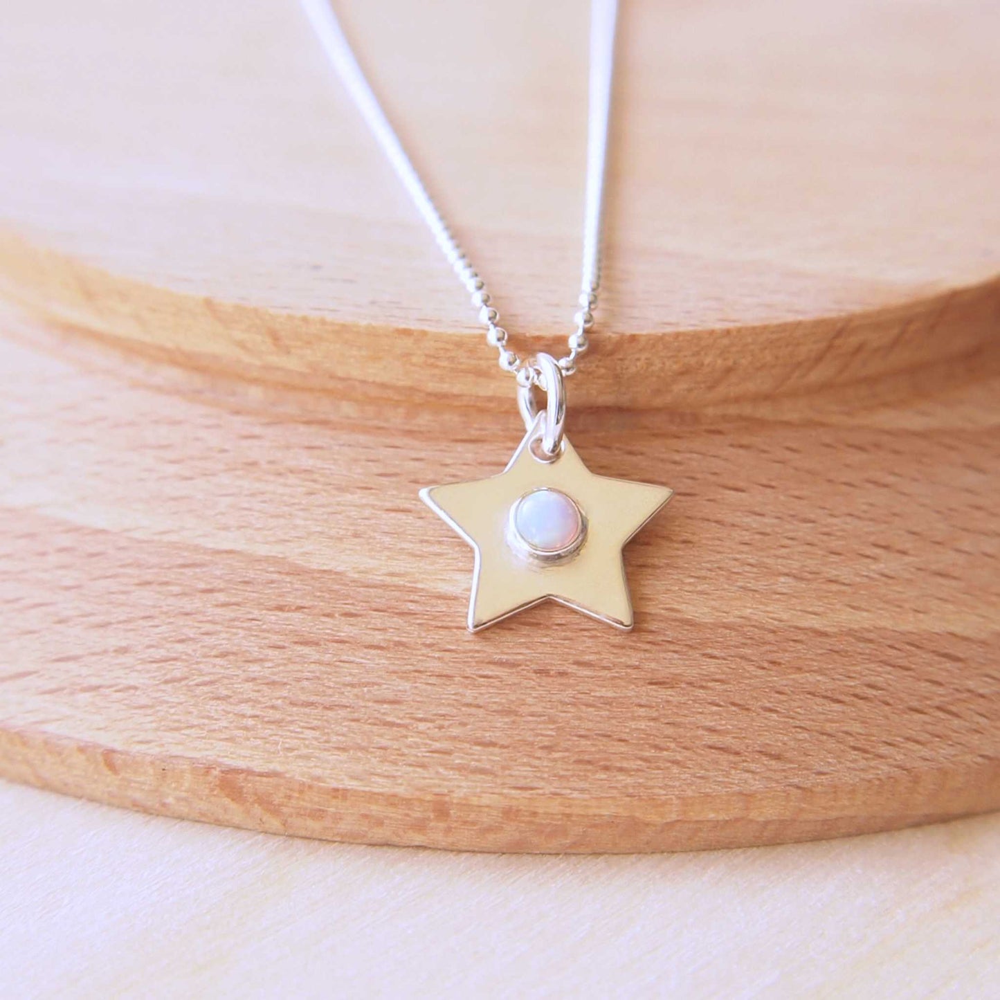 October Birthstone star charm necklace in Sterling SIlver with Opal centre. Handmade in Scotland by maram jewellery