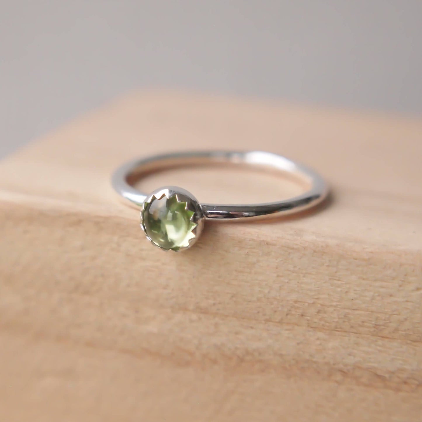 Peridot and sterling silver simple gemstone ring with a peridot 5mm cabochon. Handmade in Scotland by maram jewellery