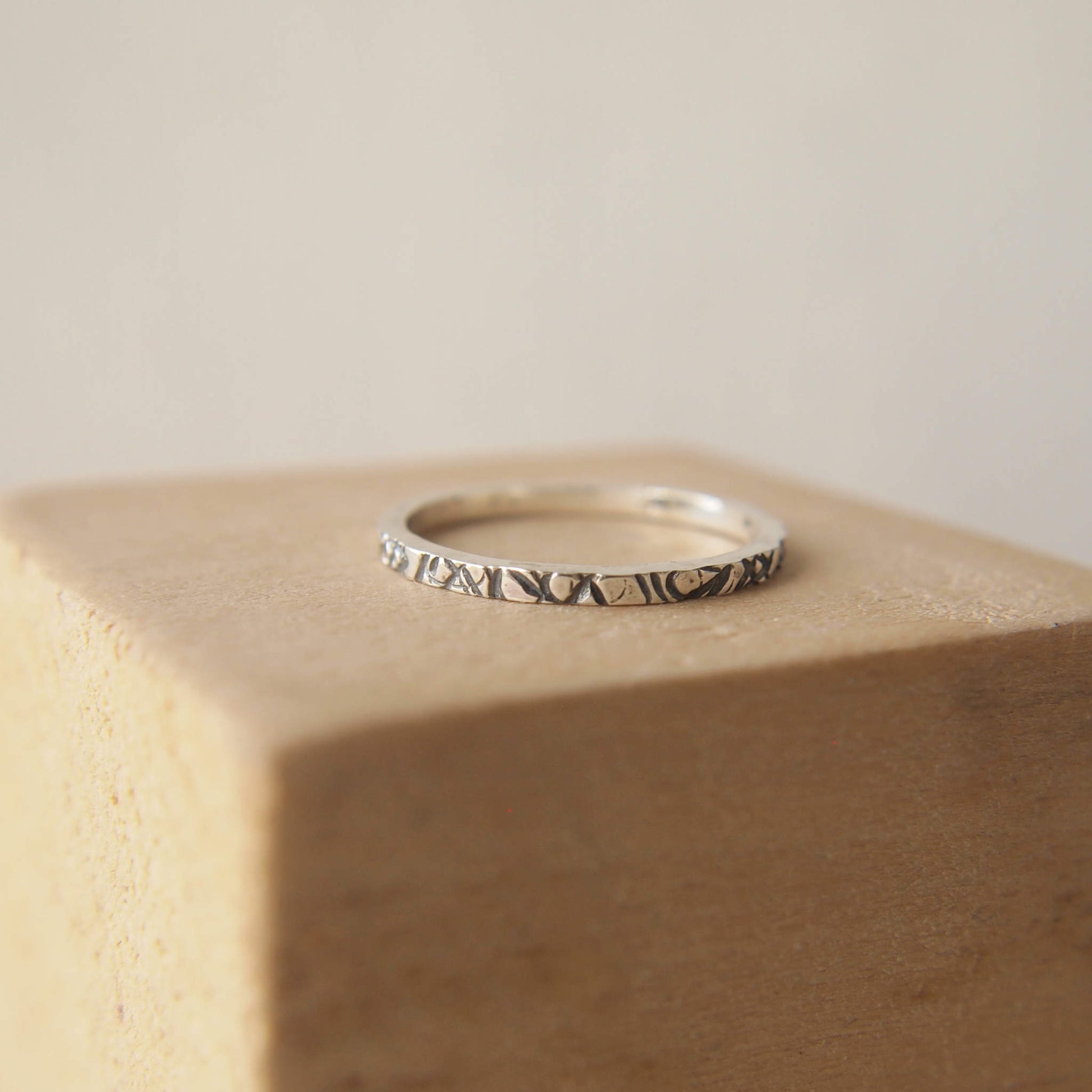 Silver plain band ring with lines pattern. ideal for stacking with other rings. Handmade in Scotland by maram jewellery