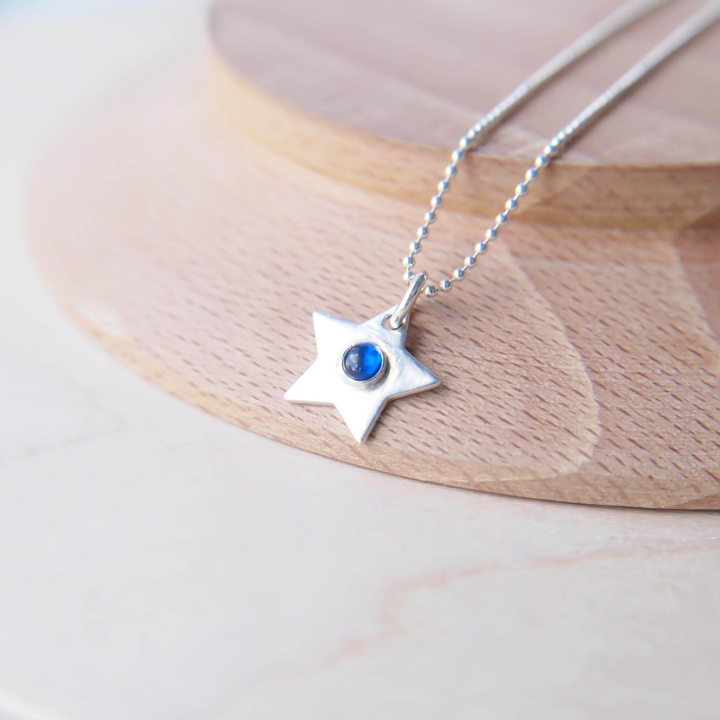Lab Sapphire sterling silver star pendant with September Birthstone