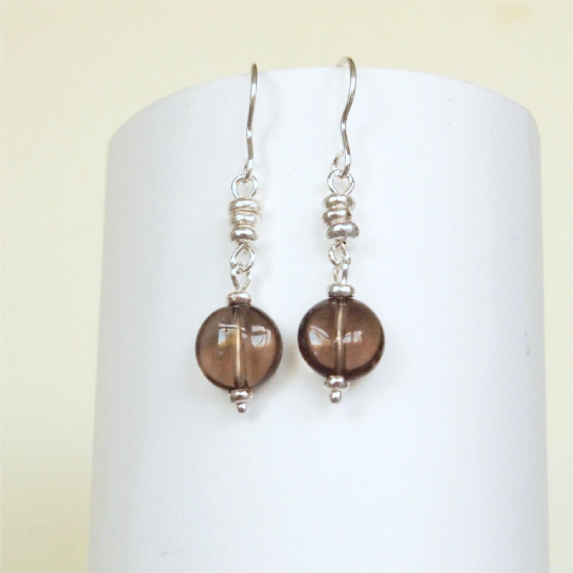 Smoky Quartz and Sterling Silver dropper earrings. made from recycled silver beads and a 1cm round smoky quartz drop. Made in Scotland by maram jewellery