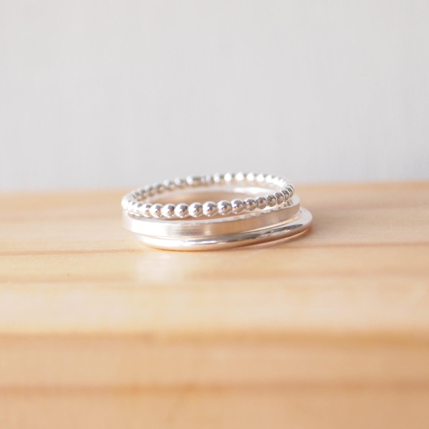 three textured plain band rings with round, square and bubble bands. Handmade in Scotland by maram jewellery