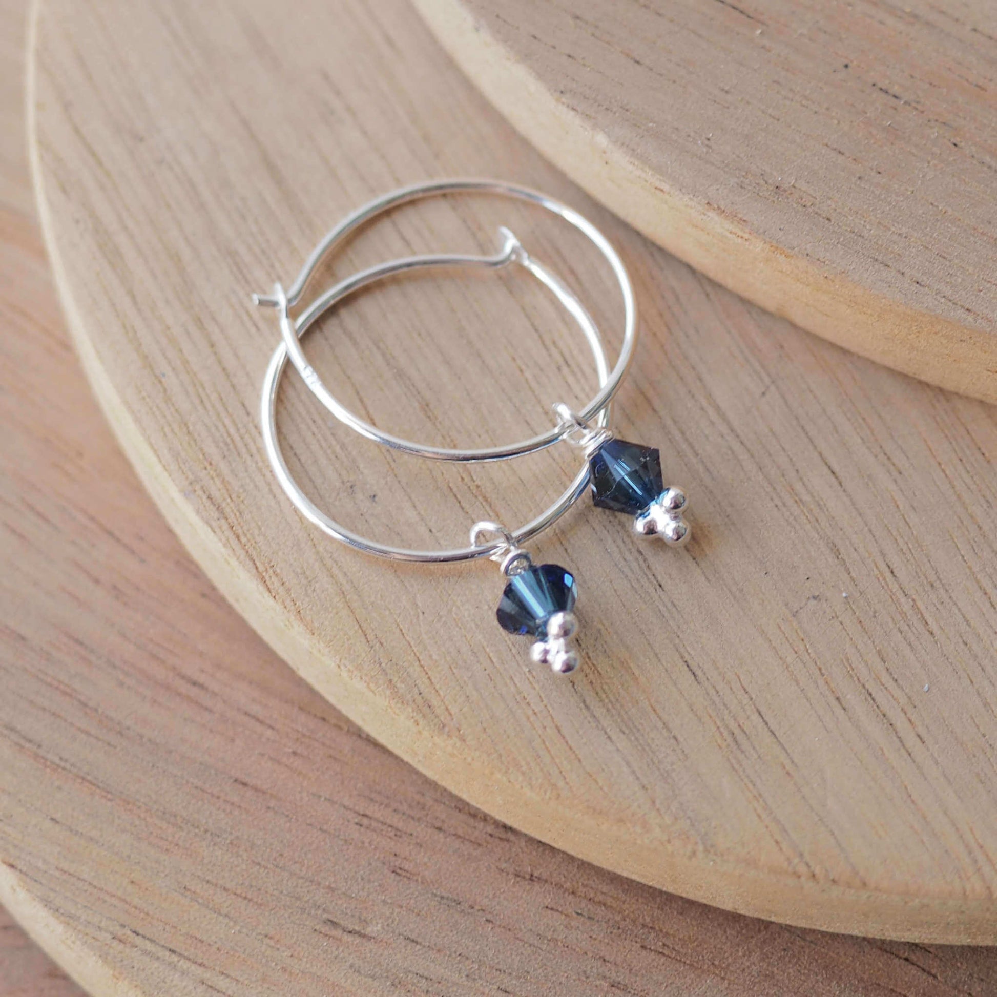 Teal Crystal simple wire hoop earrings with a crystal dropper in a petrol blue. Handmade in Scotland UK by maram jewellery