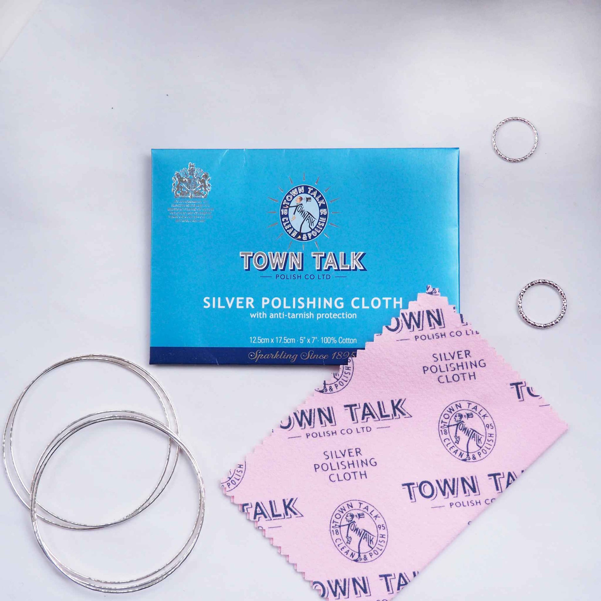 Pink impregnated polishing cloth for jewellery in a blue card folder by leading jewellery care company Town Talk, supplied by maram jewellery