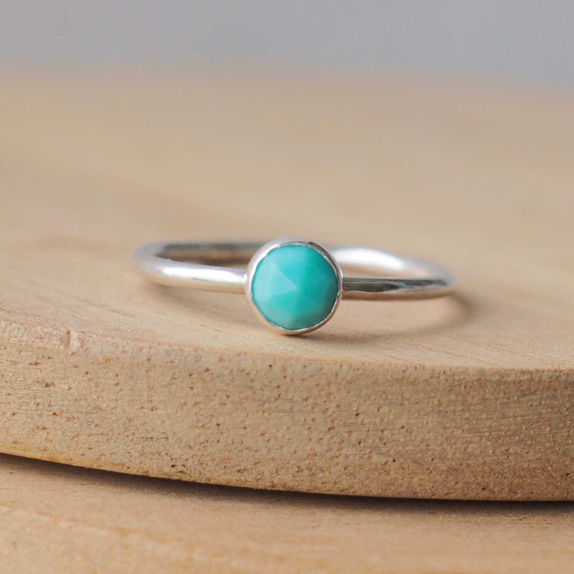 Turquoise and Sterling Silver Ring made from a small 5mm round turquoise gemstone set simply onto a modern band of round wire. Handmade to your ring size by maram jewellery in Scotland