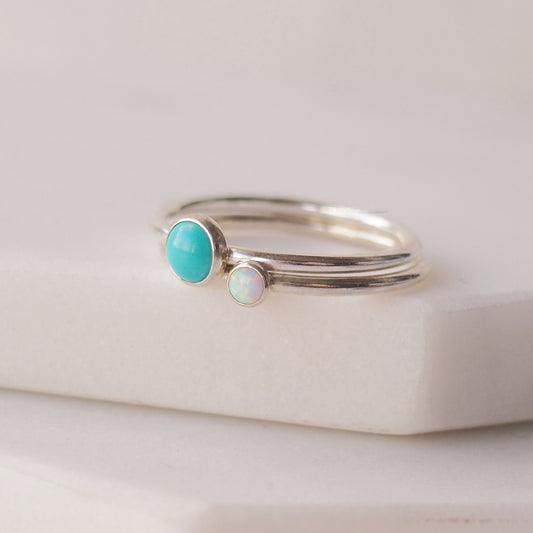 Two silver rings with Turquoise and Lab Opal  gemstones. Birthstones for December and October. Handmade to your ring size by maram jewellery in Scotland , UK