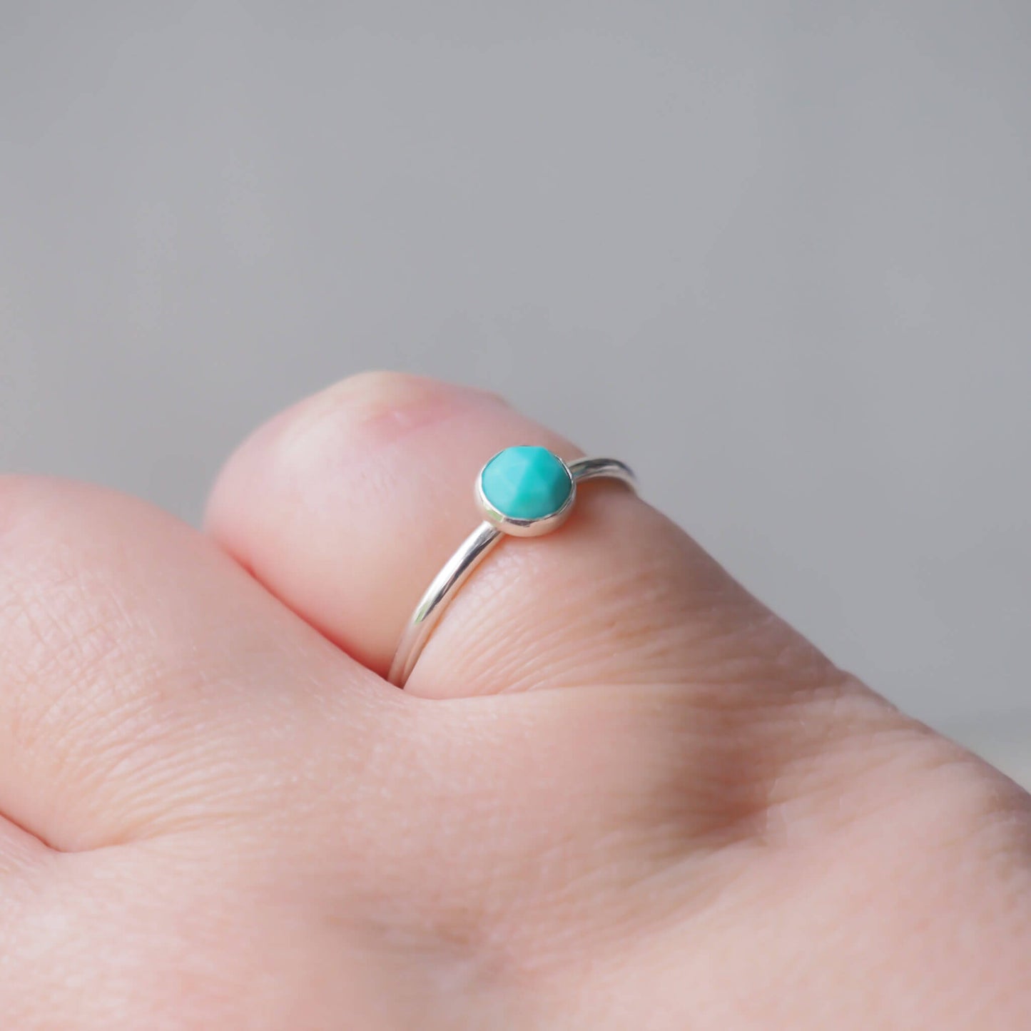silver and turquoise solitaire ring worn on hand. Handmade in Scotland by maram jewellery