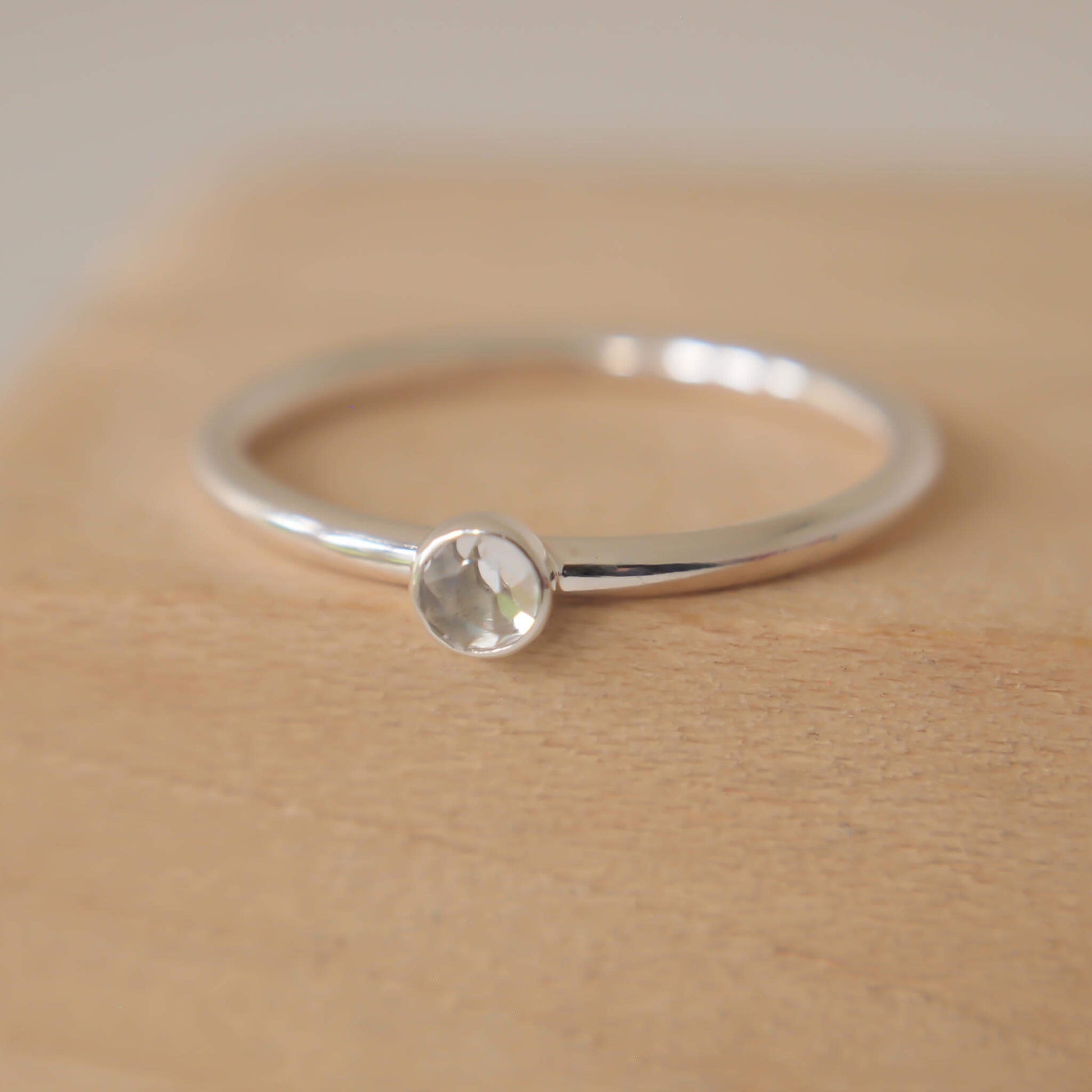 White Topaz and Sterling Silver simple minimalist ring with a 3mm round clear facet cut White Topaz, Birthstone for April. Handmade in Scotland by maram jewellery